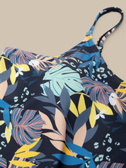 Floral patterned dress with colorful leaves on a beige background