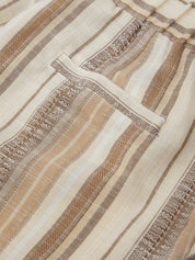 Close-up of textured fabric with brown and beige stripes