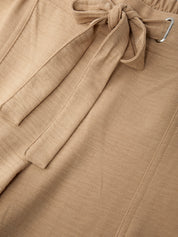 Close-up of a beige fabric with a tie detail