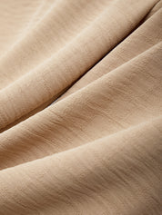 Close-up of beige fabric with visible texture