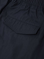 Close-up of a navy blue fabric with a pocket detail