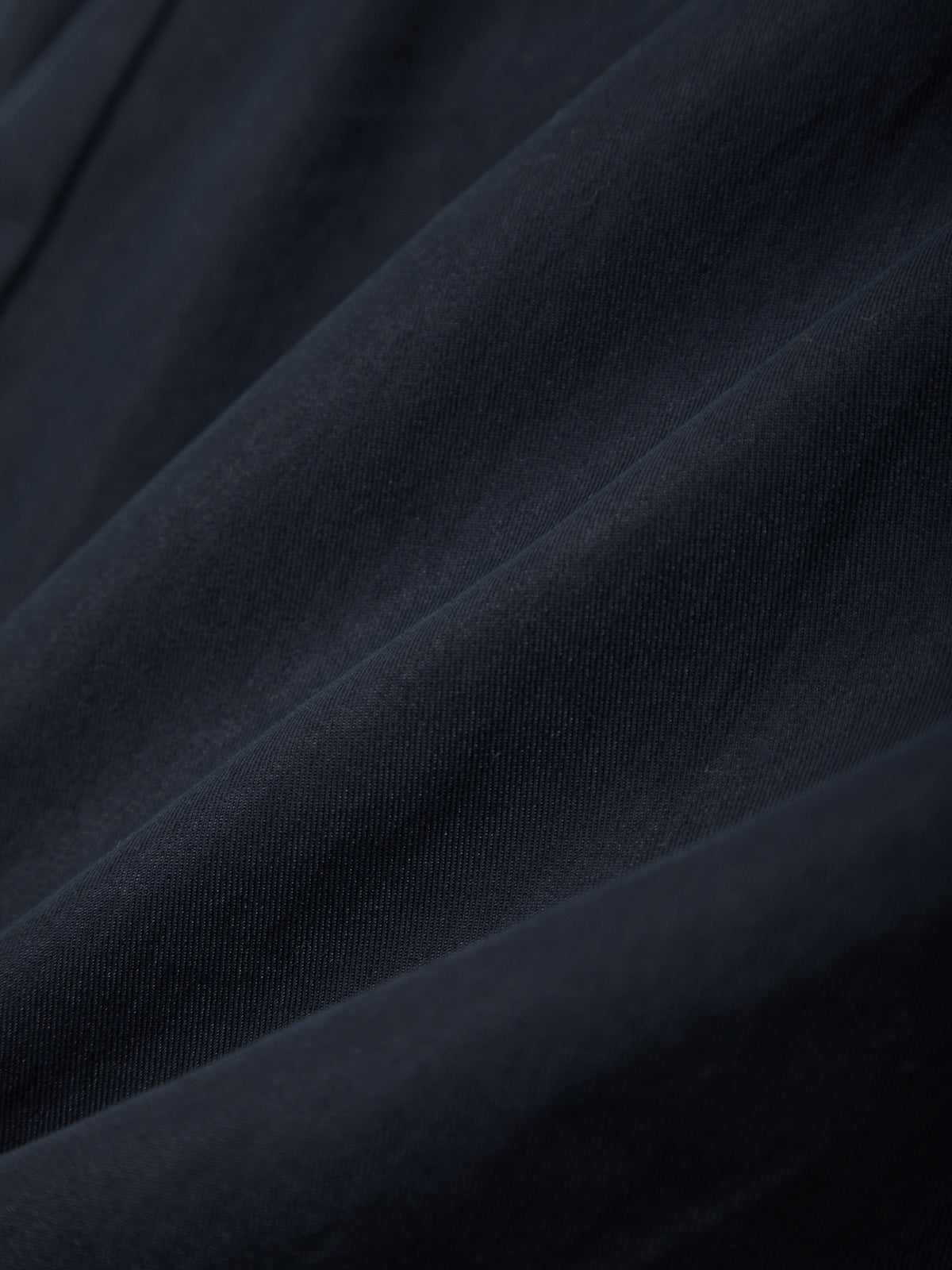 Close-up of dark blue fabric with visible texture