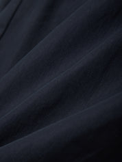 Close-up of dark blue fabric with visible texture