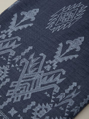 Navy blue fabric with intricate white geometric patterns