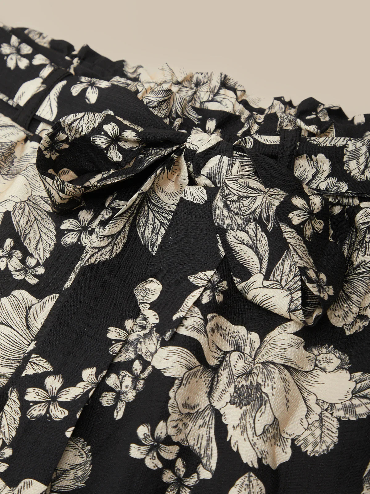 Black fabric with white floral pattern