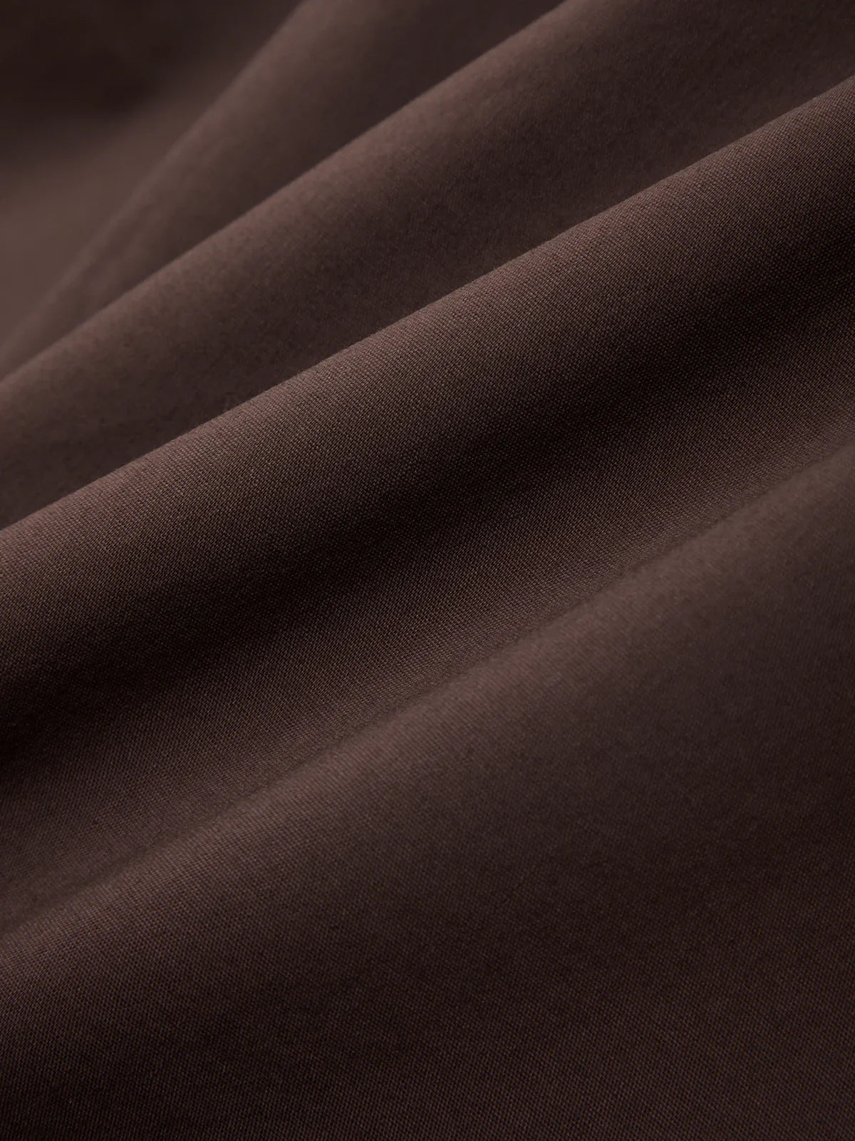 Close-up of brown fabric with folds