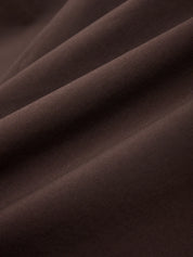 Close-up of brown fabric with folds