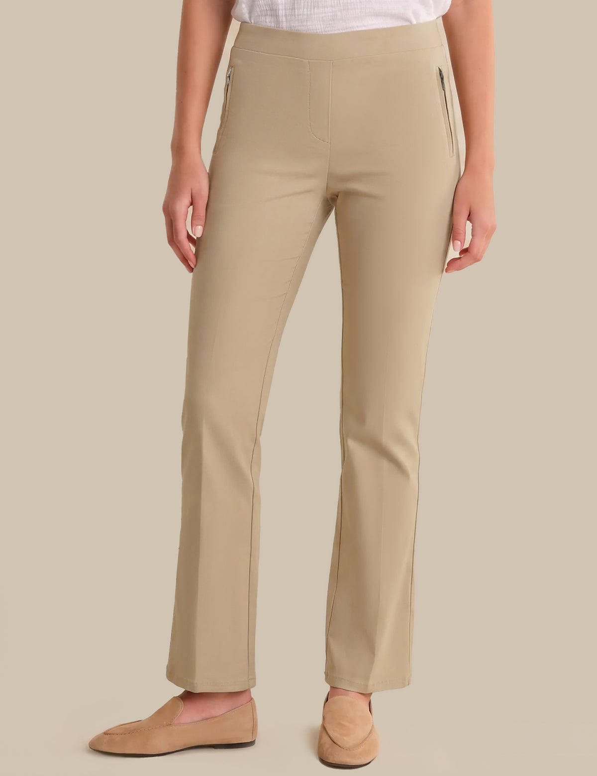 Beige pants worn by a person on a beige background