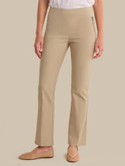 Beige pants worn by a person on a beige background