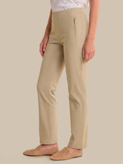 Beige pants worn by a person on a beige background