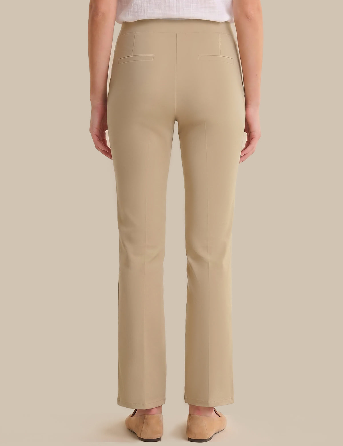 Beige pants worn by a person on a beige background