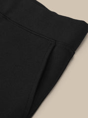 Close-up of black fabric on a beige background