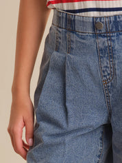 Close-up of blue jeans with a neutral background