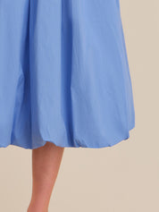 Light blue skirt on a beige background