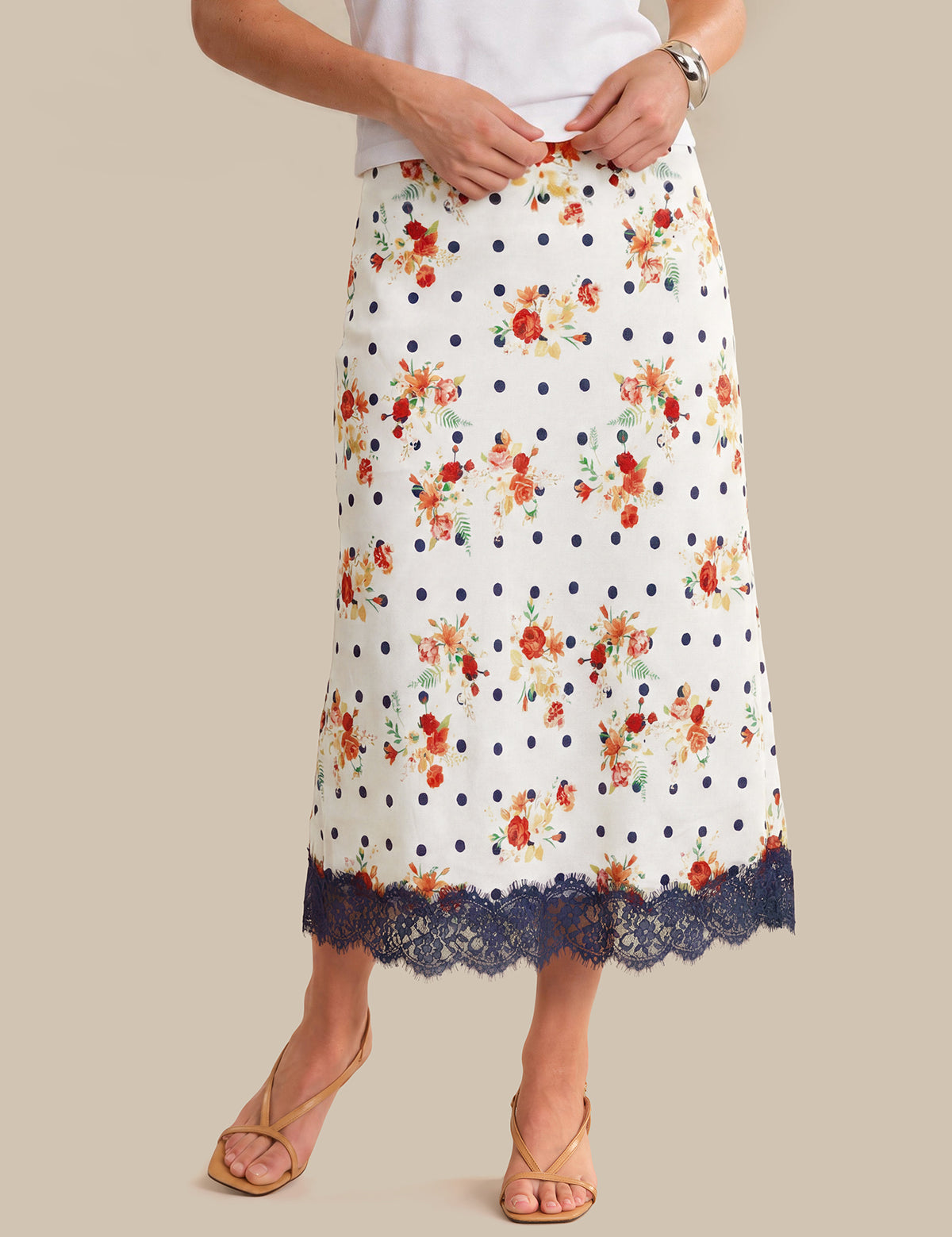 Skirt with floral and polka dot pattern on a beige background