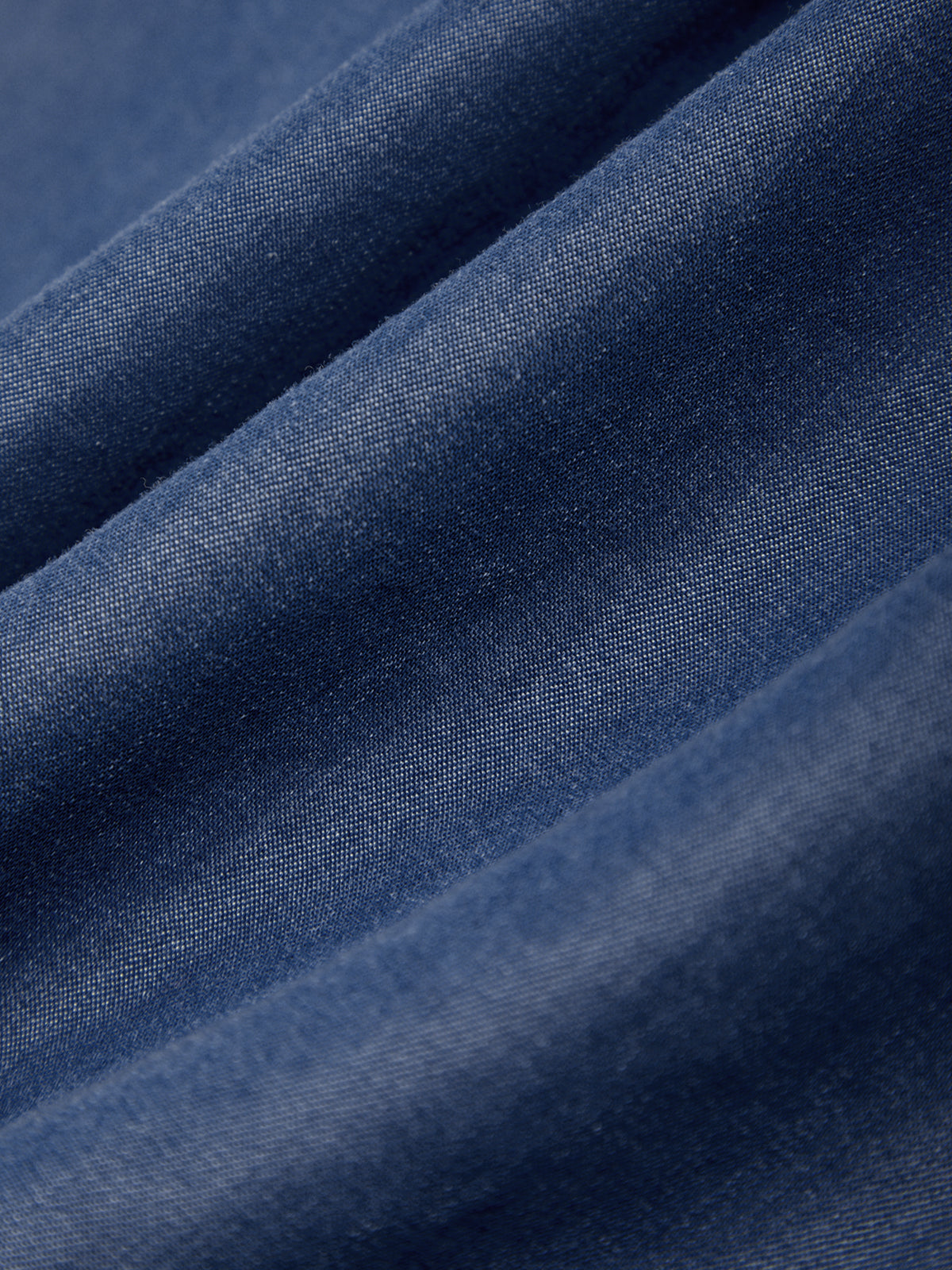 Close-up of blue fabric with a textured pattern