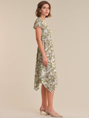 Woman wearing a floral dress on a beige background