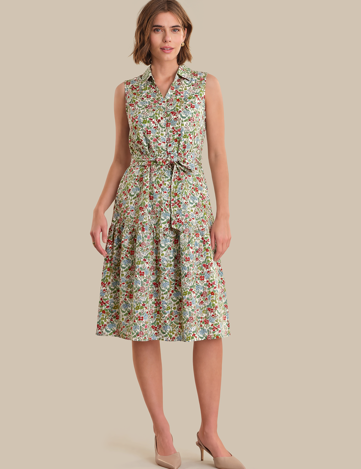 Woman wearing a floral dress on a beige background