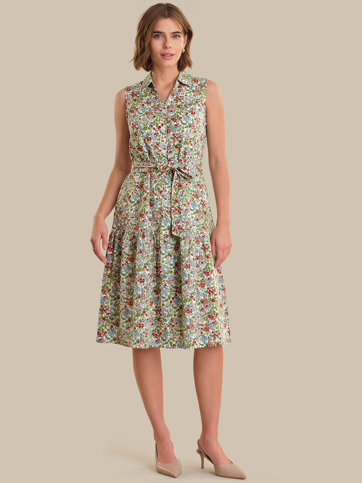 Woman wearing a floral dress on a beige background
