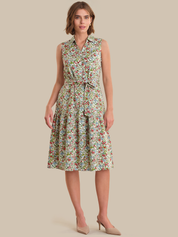 Woman wearing a floral dress on a beige background