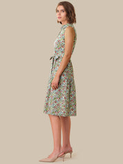 Woman wearing a floral dress against a beige background