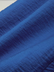Close-up of blue fabric with a textured pattern