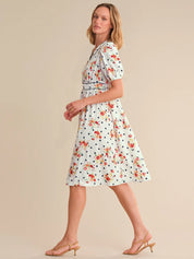 Woman wearing a floral dress on a beige background