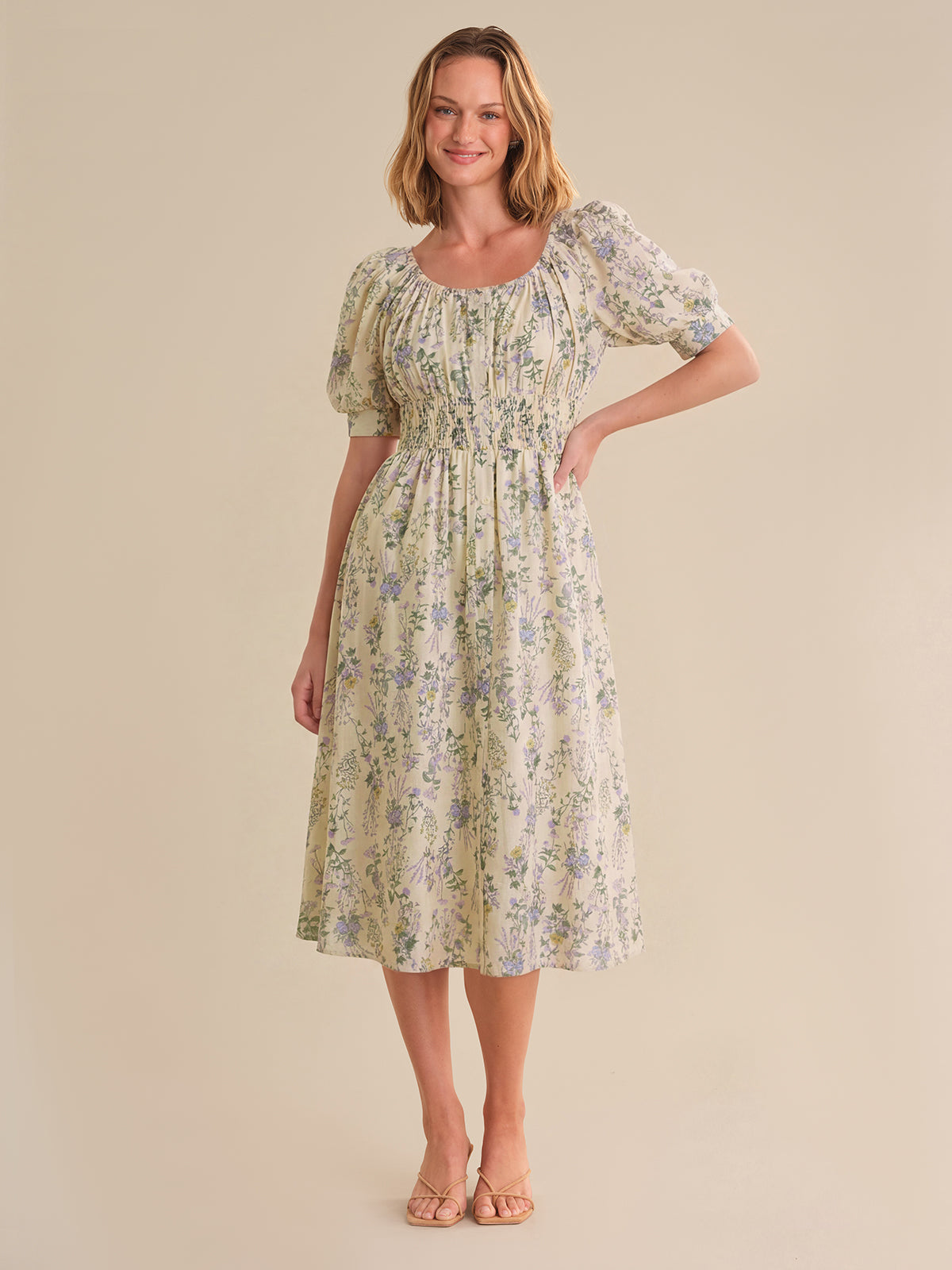 Woman wearing a floral dress against a beige background