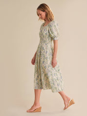 Woman wearing a floral dress on a beige background