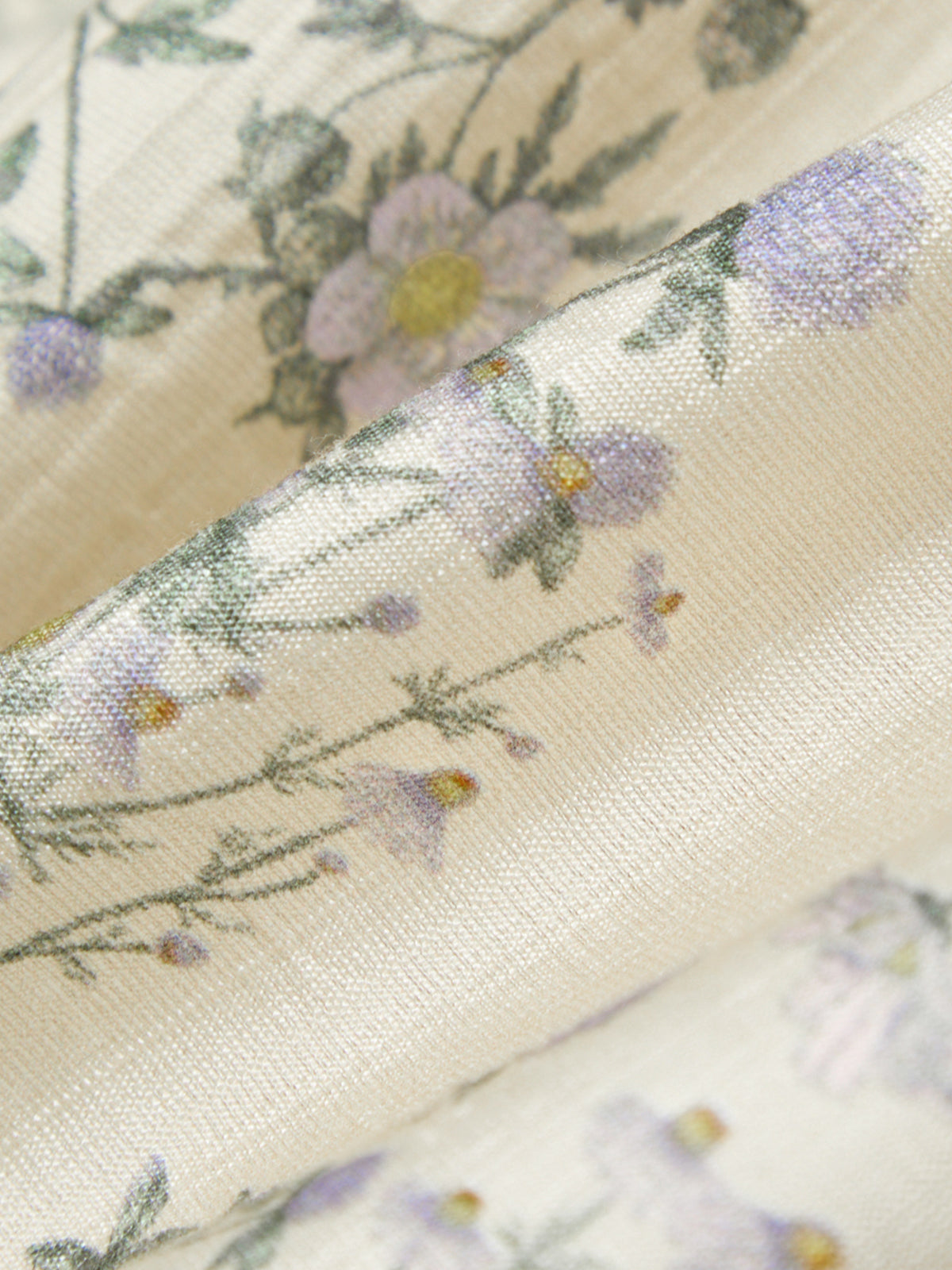 Close-up of floral fabric with a soft focus on a light background