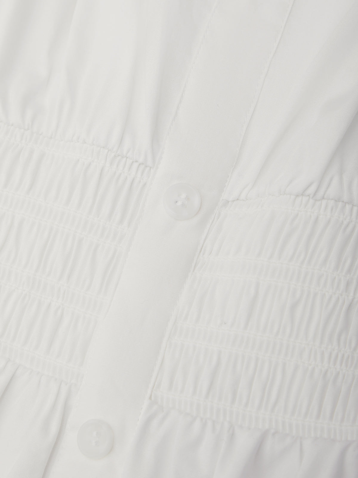 Close-up of a textured white fabric surface