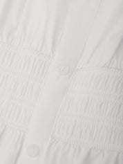 Close-up of a textured white fabric surface