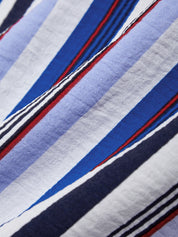 Close-up of fabric with blue, red, and white stripes.