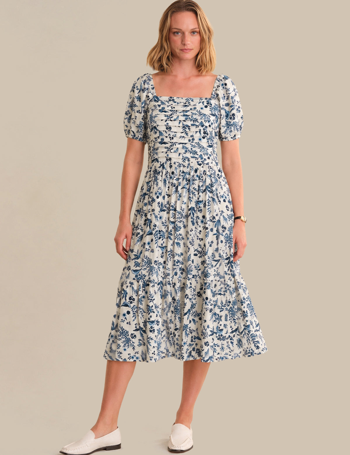 Woman wearing a floral dress on a beige background