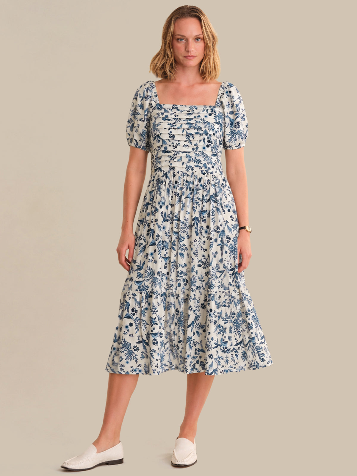 Woman wearing a floral dress on a beige background