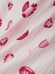 Pink fabric with red lip prints on a pink background