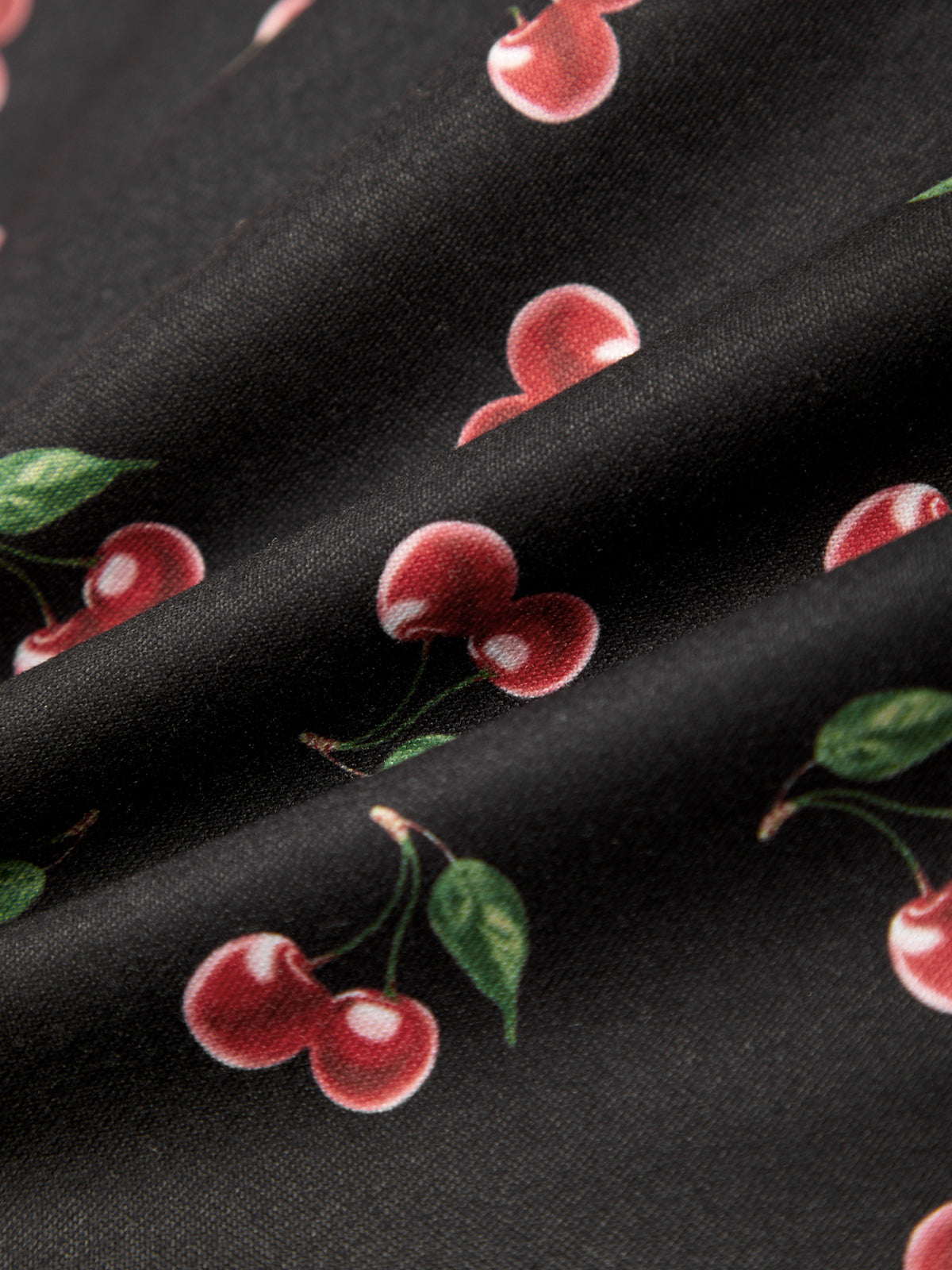 Black fabric with red cherry pattern
