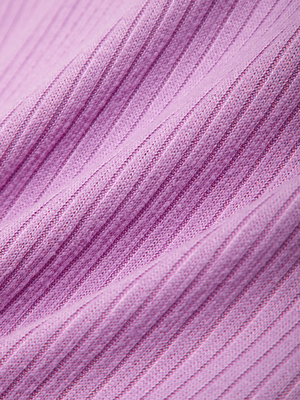 Close-up of a textured purple fabric with a gradient effect.