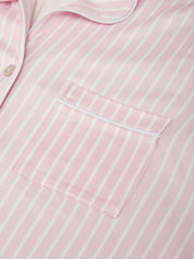 Close-up of a pink and white striped shirt with a pocket.
