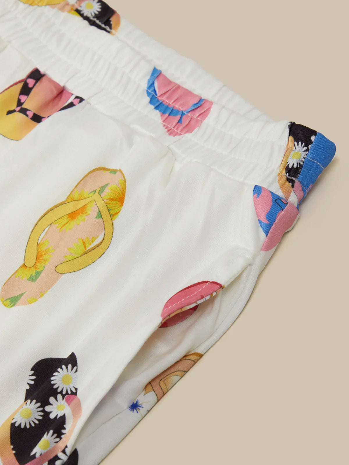 Colorful fabric with printed patterns on a beige background