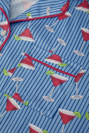 Blue striped shirt with red and white cocktail pattern