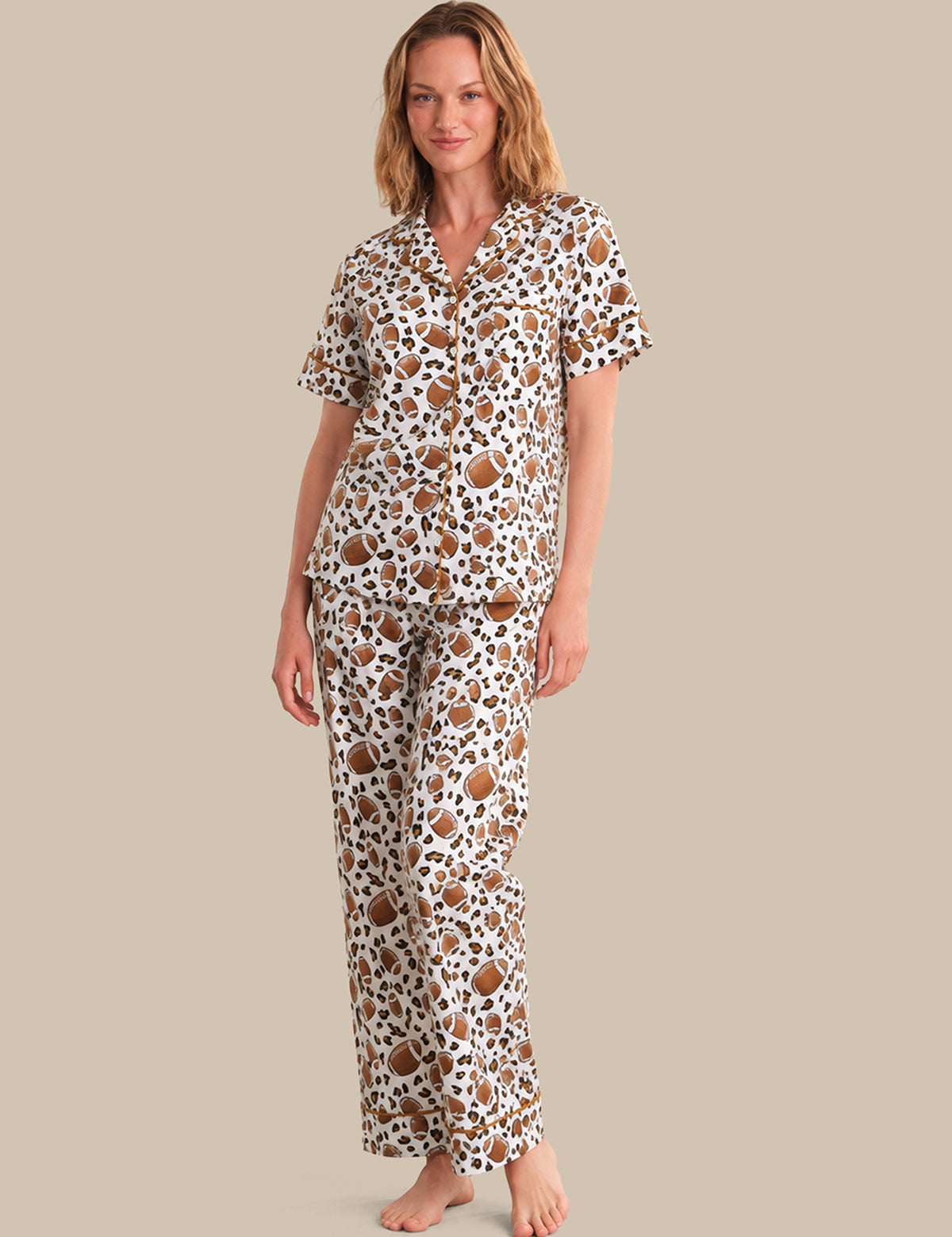 Woman wearing a patterned pajama set on a beige background