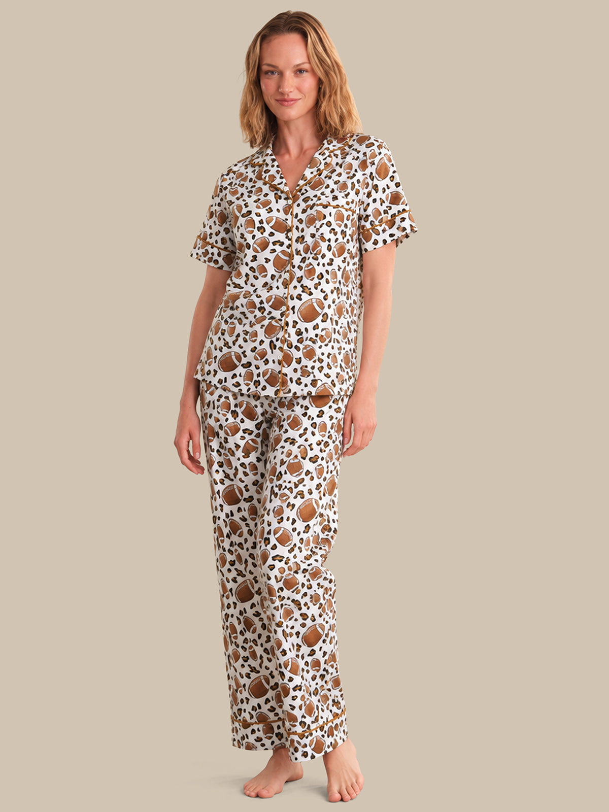 Woman wearing a patterned pajama set on a beige background