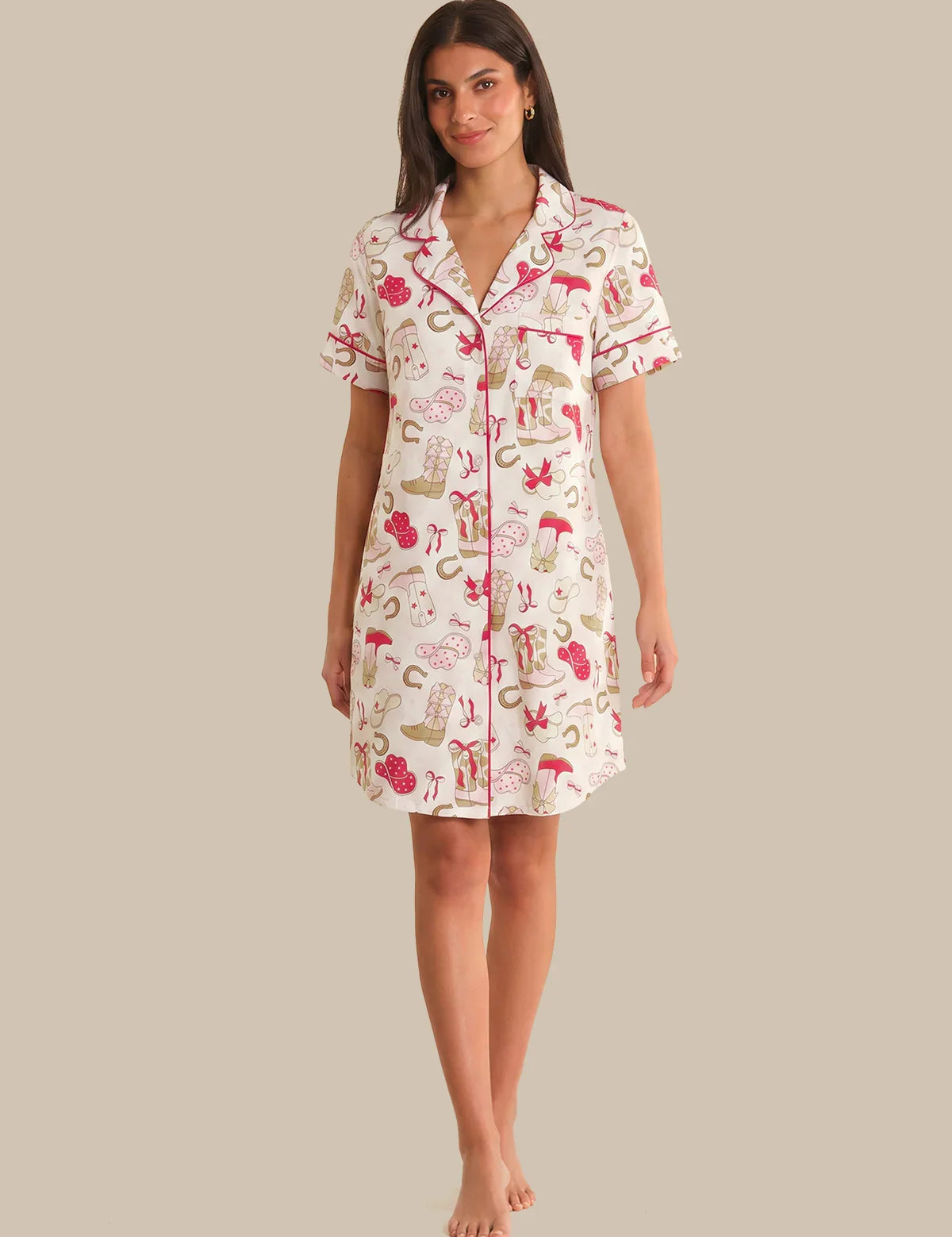 Woman wearing a patterned nightshirt on a plain background