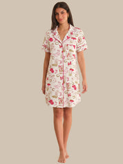 Woman wearing a patterned nightshirt on a plain background