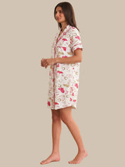 Woman wearing a patterned nightshirt on a beige background