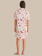 Woman wearing a patterned nightshirt on a beige background