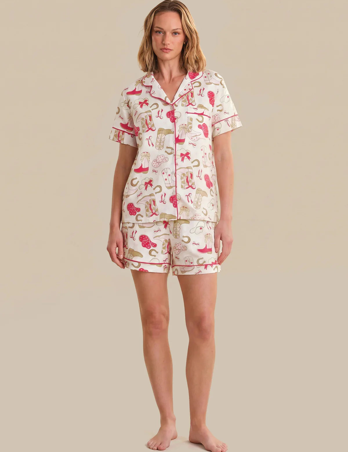 Woman wearing a patterned pajama set on a beige background