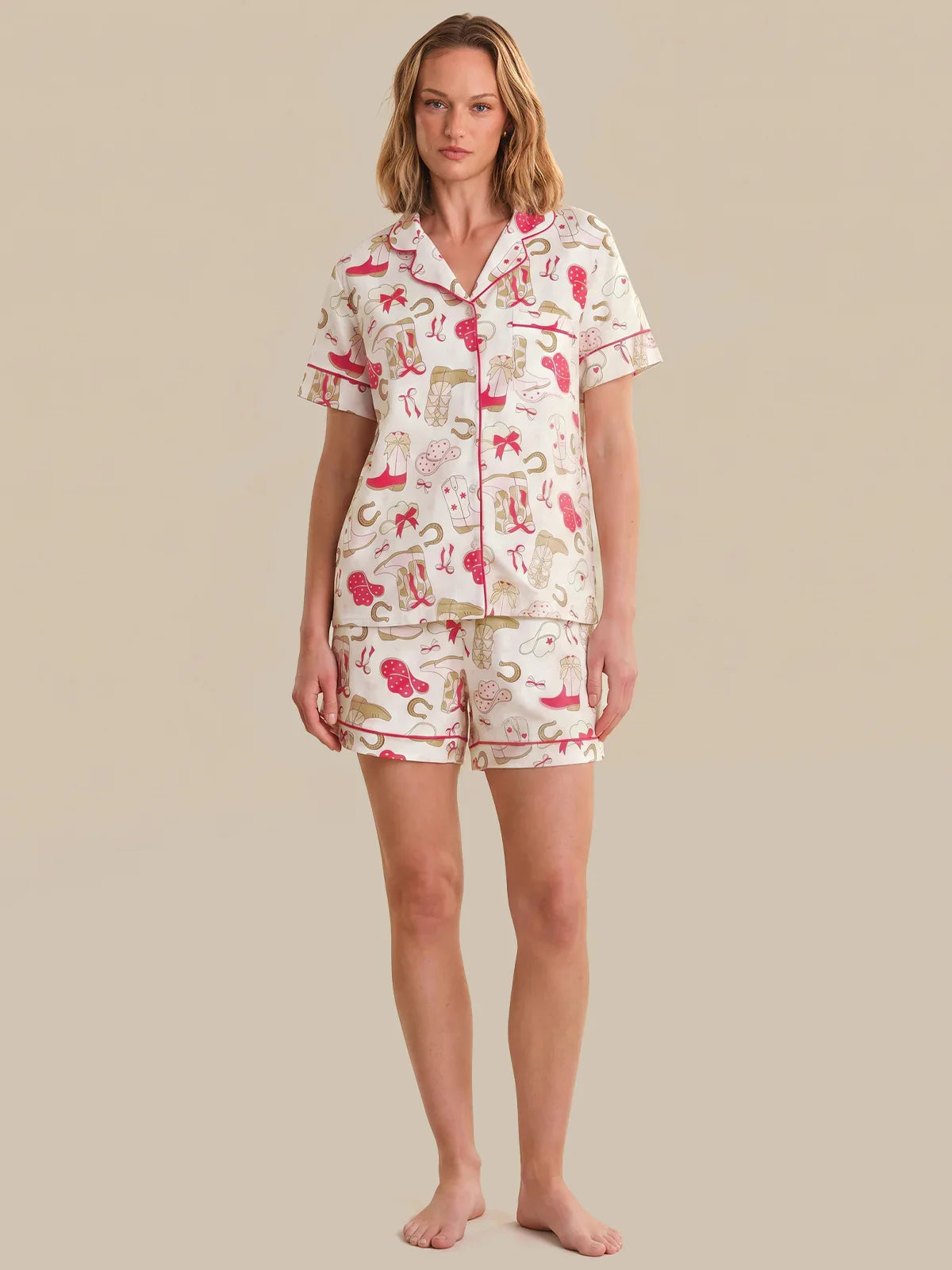 Woman wearing a patterned pajama set on a beige background