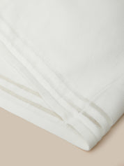 Close-up of white fabric on a beige background